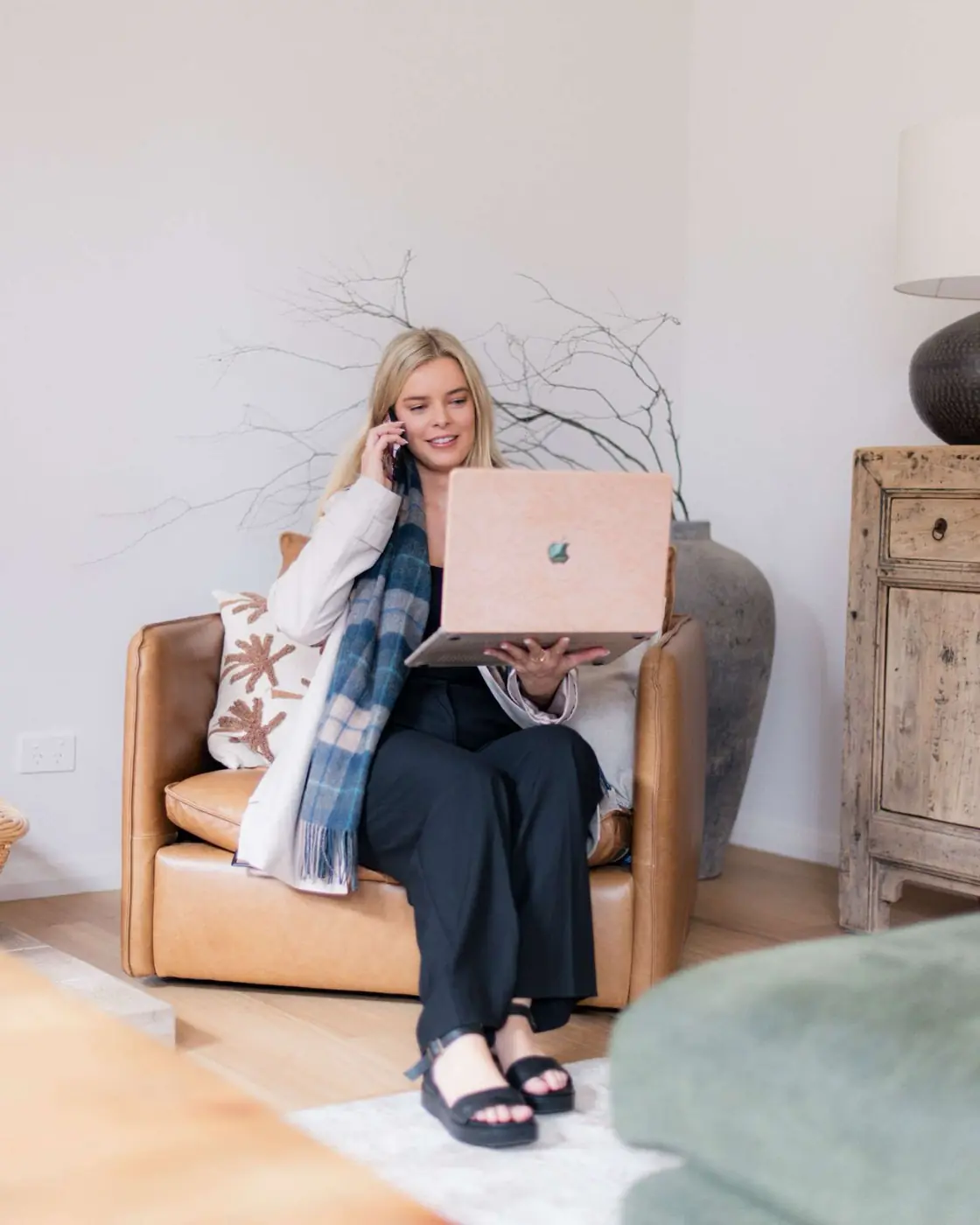 Charlotte from Comfy Creative on a call with her laptop