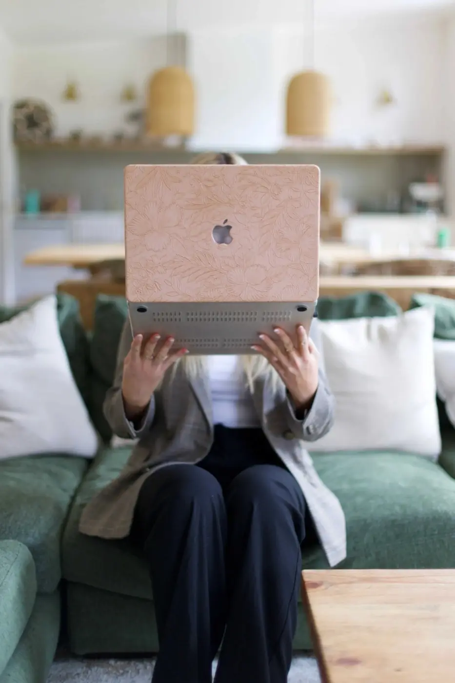 Laptop open on a sofa, ready to send an email campaign