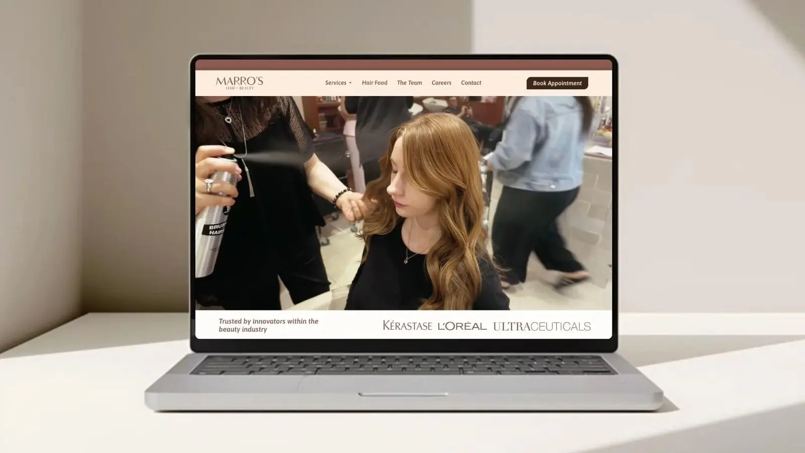 Marro's hair salon website on a laptop