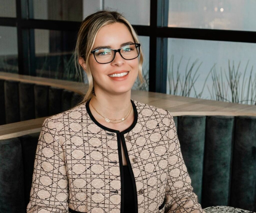 Women sitting at cafe smiling at camera